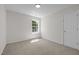 Bedroom features neutral carpet, natural light, and a large closet door at 103 Burham Ct, Apex, NC 27502