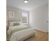 Bedroom with a window view and hardwood flooring at 103 Burham Ct, Apex, NC 27502