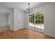 Dining room with sliding glass doors to patio and modern chandelier at 103 Burham Ct, Apex, NC 27502