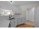Quartz countertops accent this kitchen, flowing into adjacent room at 103 Burham Ct, Apex, NC 27502