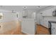 Bright kitchen features white cabinets, modern countertops and stainless steel appliances at 103 Burham Ct, Apex, NC 27502