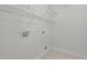 Functional laundry room with shelving and hookups for washer and dryer at 103 Burham Ct, Apex, NC 27502