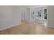 Bright living room with large windows, hardwood floors, and classic wainscoting at 103 Burham Ct, Apex, NC 27502