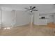 Open-concept living room with ceiling fan, fresh paint, and lots of natural light at 103 Burham Ct, Apex, NC 27502
