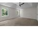 Spacious main bedroom with tray ceiling, ceiling fan, carpet and lots of natural light at 103 Burham Ct, Apex, NC 27502
