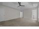 Large main bedroom with carpet, tray ceiling and entry to en-suite bathroom at 103 Burham Ct, Apex, NC 27502