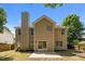 Two-story home with large back yard, patio, and lush, mature trees at 103 Burham Ct, Apex, NC 27502