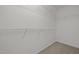 Walk-in closet with built-in shelving at 103 Burham Ct, Apex, NC 27502