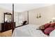 Comfortable bedroom featuring a four-poster bed and a classic wooden dresser at 1035 Aquilla Rd, Benson, NC 27524