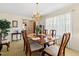 Traditional dining room featuring a chandelier, large table with seating, and natural light at 1035 Aquilla Rd, Benson, NC 27524