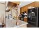 Kitchen island with sink and black appliances at 1035 Aquilla Rd, Benson, NC 27524