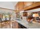 Spacious kitchen featuring granite countertops and view of the living room at 1035 Aquilla Rd, Benson, NC 27524