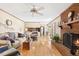 Living room with fireplace, hardwood floors, and neutral decor at 1035 Aquilla Rd, Benson, NC 27524