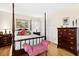 Bedroom with four-poster bed and matching dresser at 1035 Aquilla Rd, Benson, NC 27524