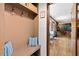 Mudroom with decorative pillow and hardwood floors leading into the home's other living spaces at 1035 Aquilla Rd, Benson, NC 27524