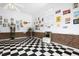 Spacious room with checkered floors, brick accents, and vintage decor touches at 1035 Aquilla Rd, Benson, NC 27524