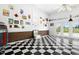 Spacious room with checkered floors, brick accents, and vintage decor touches at 1035 Aquilla Rd, Benson, NC 27524