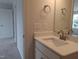Clean bathroom with a white vanity, modern fixtures, and a well-lit mirror for a functional space at 1042 Tulloch Court Ct # 213, Burlington, NC 27215