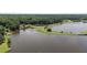 Stunning aerial view of a community lake, with lush green spaces, providing scenic views at 1051 Upland Reach, Sanford, NC 27332