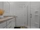 Bathroom features a glass enclosed shower, vanity, sink, and mirror at 1051 Upland Reach, Sanford, NC 27332