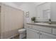 Bathroom features a combination shower and tub with a vanity and mirror at 1051 Upland Reach, Sanford, NC 27332