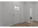 Inviting entryway featuring a door with glass inserts and vinyl flooring at 1051 Upland Reach, Sanford, NC 27332