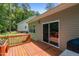 Exterior view of the home with a deck, sliding glass door, and vinyl siding at 1051 Upland Reach, Sanford, NC 27332