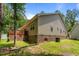 Home exterior featuring vinyl siding, a brick foundation, and a deck at 1051 Upland Reach, Sanford, NC 27332