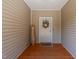 Inviting front door with a wreath and a welcome mat, creating a warm and friendly entrance at 1051 Upland Reach, Sanford, NC 27332