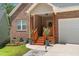 Charming brick home with covered front entrance, flower boxes, and a well-manicured lawn at 1051 Upland Reach, Sanford, NC 27332