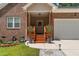 Charming brick home with covered front entrance, flower boxes, and a well-manicured lawn at 1051 Upland Reach, Sanford, NC 27332