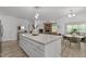 Open concept kitchen featuring a large island, modern finishes, and breakfast nook at 1051 Upland Reach, Sanford, NC 27332