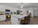 Spacious kitchen featuring stainless appliances, a large island, and breakfast bar at 1051 Upland Reach, Sanford, NC 27332