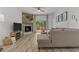 Cozy living room featuring a wood-burning fireplace, a sectional sofa, and natural light at 1051 Upland Reach, Sanford, NC 27332