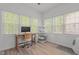 Bright sun room with a desk next to the window and a cat tower at 1051 Upland Reach, Sanford, NC 27332