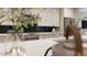 Modern kitchen with stainless appliances, white cabinets, and black backsplash for a sophisticated look at 1053 Hardin Hill Ln, Knightdale, NC 27545