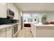 Spacious kitchen featuring white cabinets, stainless steel appliances, and an open design for entertaining at 1053 Hardin Hill Ln, Knightdale, NC 27545