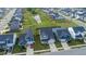 A neighborhood aerial view of a planned community with well-manicured lawns and a central water feature at 1104 Briar Gate Dr, Holly Springs, NC 27540