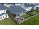 Aerial view of a fenced backyard with a patio, screened porch and outdoor furniture at 1104 Briar Gate Dr, Holly Springs, NC 27540