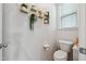 Clean bathroom with hanging plants and a toilet at 1104 Briar Gate Dr, Holly Springs, NC 27540