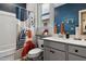 Well-lit bathroom featuring a tub/shower combination, vanity, and a window offering a blend of style and comfort at 1104 Briar Gate Dr, Holly Springs, NC 27540