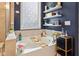 Inviting bathroom with a soaking tub, decorated shelves, and neutral tile, for a relaxing and modern experience at 1104 Briar Gate Dr, Holly Springs, NC 27540