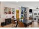 Open-concept dining room with stylish furniture, decor and seamless access to the living room at 1104 Briar Gate Dr, Holly Springs, NC 27540