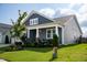 Charming home with a well-maintained front yard and inviting entrance at 1104 Briar Gate Dr, Holly Springs, NC 27540