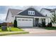 Charming home with a spacious two-car garage and beautiful landscaping at 1104 Briar Gate Dr, Holly Springs, NC 27540