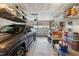 Well-organized garage featuring overhead storage racks, shelving, and a clean, epoxy-coated floor at 1104 Briar Gate Dr, Holly Springs, NC 27540