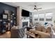 Bright and inviting living room with a fireplace, modern shelving, and comfortable seating at 1104 Briar Gate Dr, Holly Springs, NC 27540