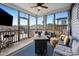 Screened porch offering an inviting outdoor living space with comfortable seating and decor at 1104 Briar Gate Dr, Holly Springs, NC 27540