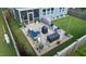 A cozy patio with comfortable outdoor seating, a modern grill, and manicured plants in decorative pots at 1104 Briar Gate Dr, Holly Springs, NC 27540