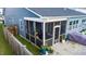 Relaxing screened-in porch with comfortable seating and access to the backyard at 1104 Briar Gate Dr, Holly Springs, NC 27540